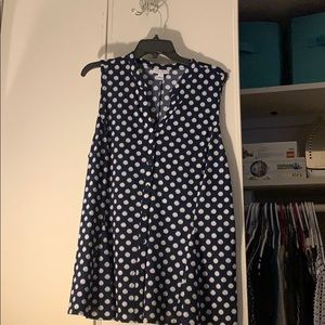New sleeveless blue shirt with white dots.